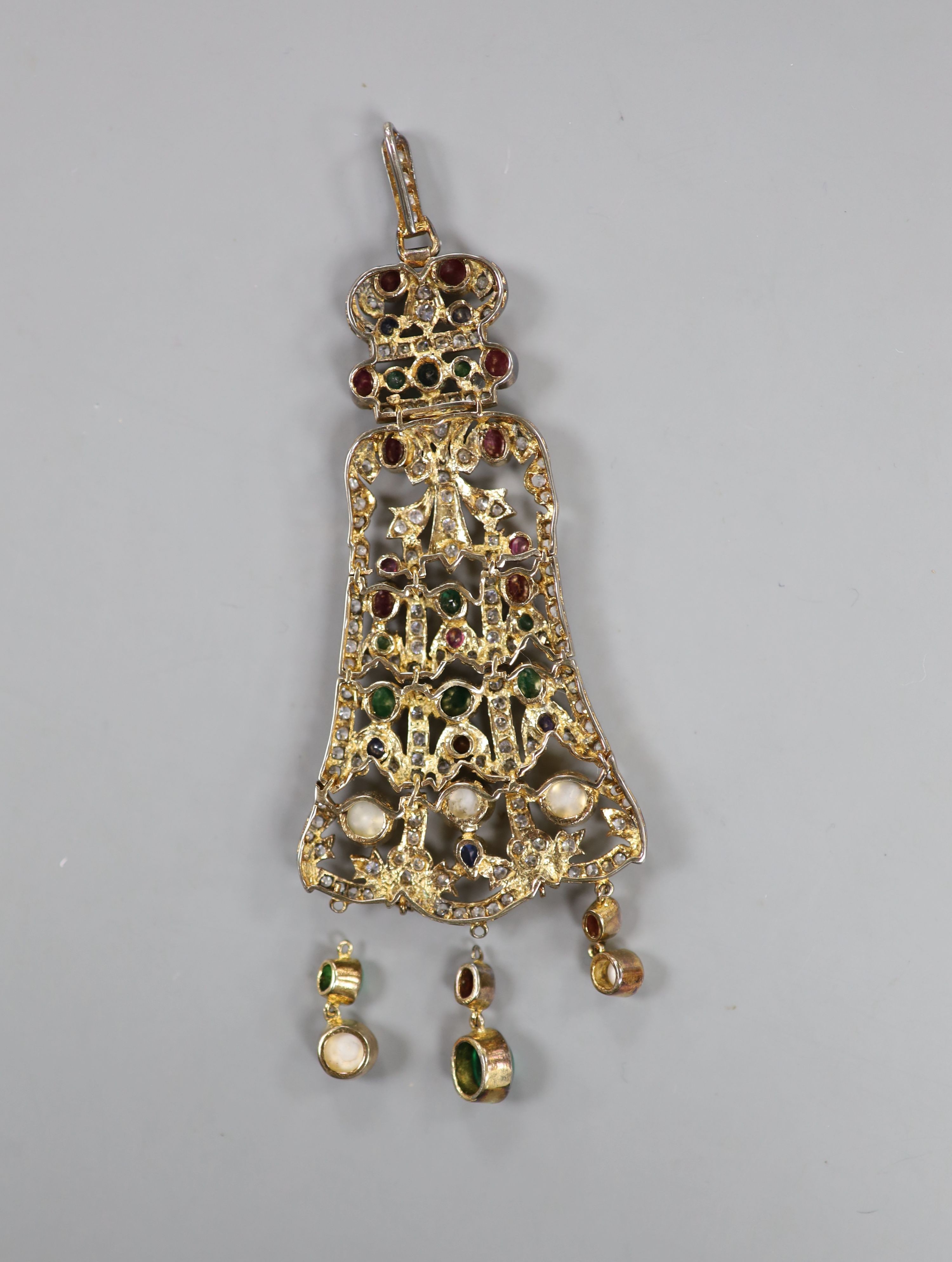 An Indian gilt metal and multi gem set drop pendant, with two loose drops, 12.7cm.